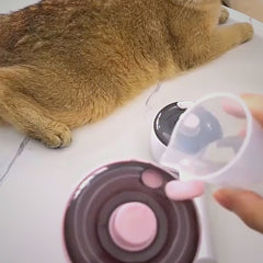 HelloBrelio brush removing loose fur from a cat